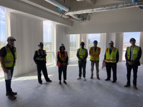Medical Examiner Wieslawa Tlomak (orange vest) stands in future medical examiner space at The Center for Forensic Science and Protective Medicine