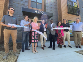 Brian Spoerl cuts ribbon for The Hampton, alongside County Executive David Crowley (right) and Sup. Anne O'Connor (right). 