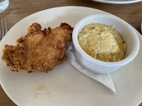 Honey dusted fried chicken and grits with goat cheese