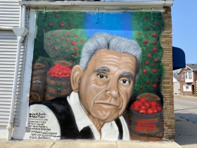 A mural by Ruben Alcantar at 8631 S. 6th St.