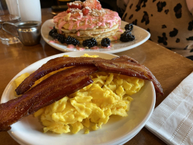Pancakes with bacon and scrambled eggs