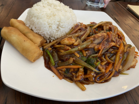 Szechuan Chicken, streamed rice, and egg rolls