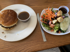 Pot roast sandwich, onion gravy, and side salad