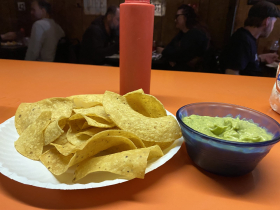 Guacamole and chips and house hot sauce