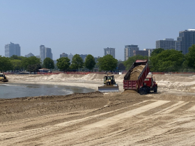 More sand is hauled in for McKinley Beach project.