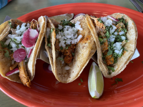 Three chicken tacos served Mexican style