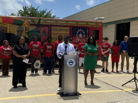 County Executive David Crowley speaks at Juneteenth bus unveiling