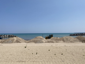 Piles of sand that will be used to fill and reconstruct McKinley Beach