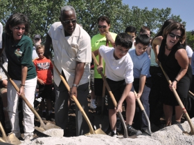 2012 - Melissa Cook (retired Hank Aaron State Trail Manager), Hank Aaron, Laura Bray (former executive director of Menomonee Valley Partners), and kids at the groundbreaking for Three Bridges Park and the Hank Aaron State Trail connecting the Valley Passage to the Mitchell Park Domes