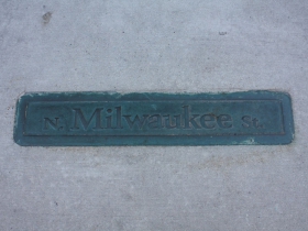 N. Milwaukee St. sign in the sidewalk