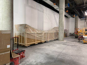 A 27-foot replica Haida carved canoe packed and moved to the new museum
