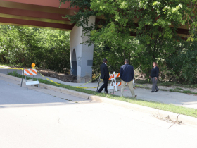 County Executive David Crowley and Parks Director Guy Smith survey trail damage