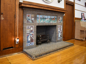 The brick and tiled fireplace at Riley Montessori
