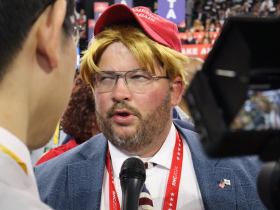 RNC attendee wearing Trump wig and MAGA hat