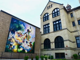 This Tia Richardson mural, 'The Rebirthing of the Earth Mother,' is part of the Historical Garfield Apartments in Bronzeville, located on Vel r. Phillips Avenue. Photo by Sue Vliet.
