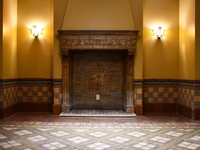 One of two lounges with floor and dado tiles created by the Continental Faience & Tile Co., as well as fireplaces with Batchelder tile mantels