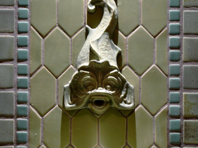 A detail image of the dolphin spout created by the Continental Faience & Tile Co.
