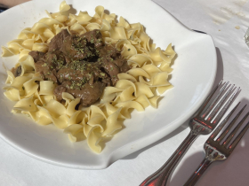 Tenderloin tips over noodles