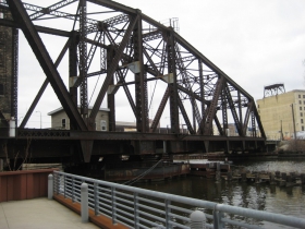 Train bridge next to The Point on the River.