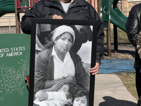 Tomas Castro with Photo of Clementina Castro