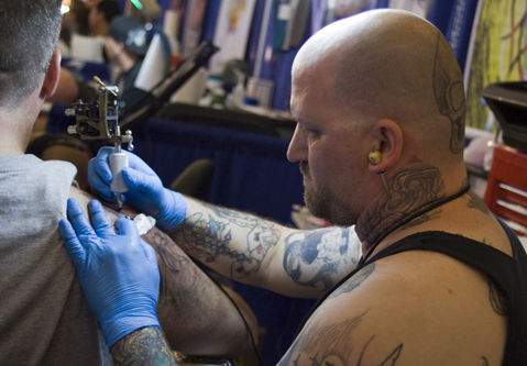 2012 Tattoo Convention  Milwaukee resident David Zielinski displays recent  work for judges Mike  