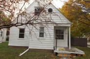 This house at 202 W. Hampton Ave. in Milwaukee is cited in the National Fair Housing Alliance discrimination complaint against Bank of America. According to the NFHA, there are 10 instances of poor maintenance or marketing practices at the Hampton Ave. address. (Photo by National Fair Housing Alliance)
