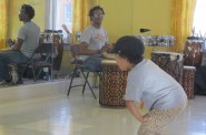 Walker's Point Center for the Arts musician "Souljah" beats the Djembe drum as young people practice African Ameri-dance. (Photo by Edgar Mendez)