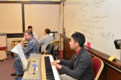 A student and teacher play a duet in a Carmen High School music class. (Photo by Sue Vliet)