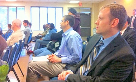 John Connolly (right), the new LISC director of community safety, listens to the presentation at the Urban Ecology Center. (Photo by Brendan O’Brien)