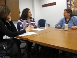 Group members discuss future plans in a meeting at Marquette University. (Photo by Courtney Perry)