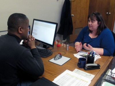 Stephanie Harling (right) discusses with Dan Woodring of Waukee Engineering Co. possibilities for the company to engage in community development. (Photo by Rob Gebelhoff)