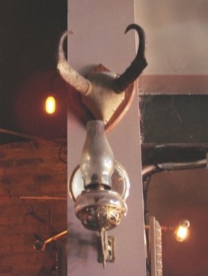An antique lamp hanging in Hotel Foster.
