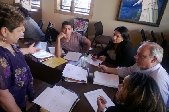 Latino Nonprofit Leadership Program participants work together to solve programs during a class. (Photo courtesy of the Latino Nonprofit Leadership Program)