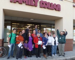 Protesters pose for a group photograph after staging a protest at Family Dollar. Bill Lueders/Wisconsin Center for Investigative Journalism