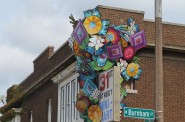 “An Arrangement,” one of four public works of art that make up “Typeface,” was installed on the boarded-up 31st Street Mini-Mart. (Photo by Andrea Waxman)