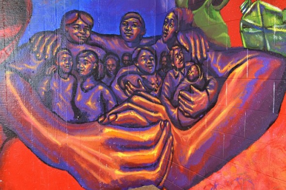 A mural at Neighborhood House of Milwaukee captures the spirit of the settlement house. (Photo by Sue Vliet)