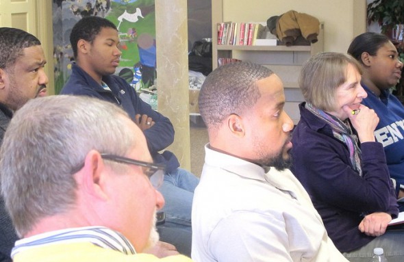 Participants listen attentively as speakers discuss community concerns. (Photo by Andrea Waxman)