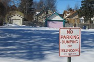 The city of Milwaukee is the reluctant landlord of about 2,700 vacant lots, most of which are marked with no trespassing signs. By the end of the year, city officials hope to convert 10 vacant lots into community gardens that will contribute fresh foods to their neighborhoods. (Photo by Scottie Lee Meyers)