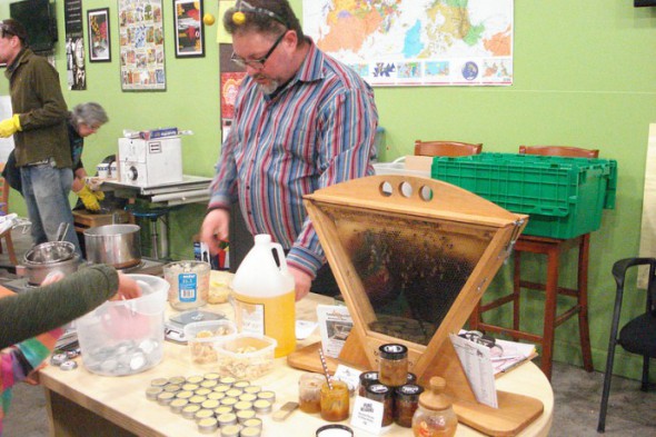Community member Charlie Koenen measures honey to make homemade lip balm. (Photo by Kelly Meyerhofer)