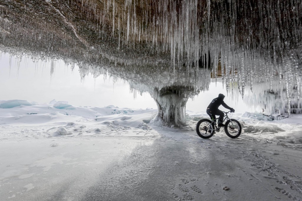 Nick Ginster rides through one of the larger frozen sea caves we found on the eastern shore of Madeline Island.