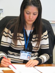 Maria Madrigal-Alvarez, a GED instructor at UMOS, prepares a lesson for her students. (Photo by Natalie Wickman)