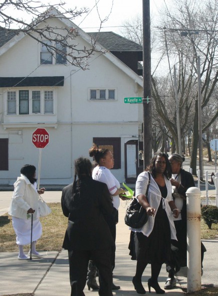 Church attendees gather outside True Love Missionary Baptist, Sunday morning, across the street from 3478 N. 2nd. (Photo by Jabril Faraj)