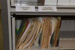 A file cabinet contains case files of the unclaimed and unidentified bodies.. (Photo by Sue Vliet)