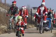 This guy gets the award for the littlest Santa with the biggest heart for scooting along on the ride!