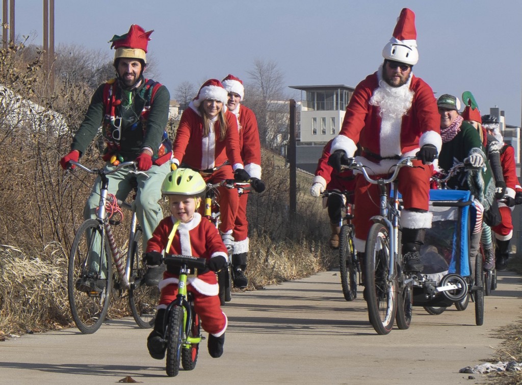 This guy gets the award for the littlest Santa with the biggest heart for scooting along on the ride!