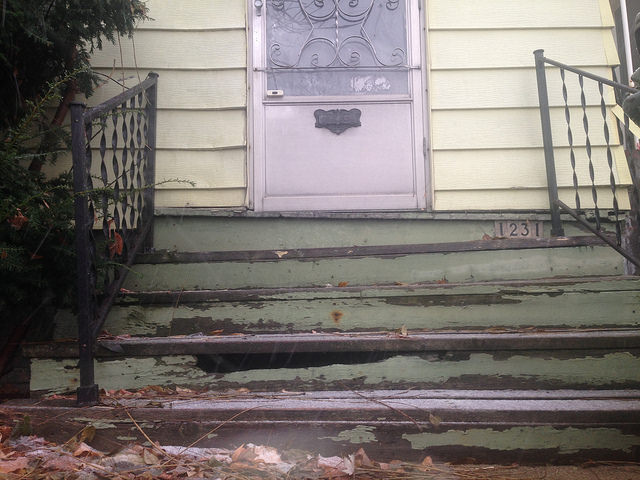 The stairs leading up to 1231 S. 24th street are crooked, chipping and cracked.