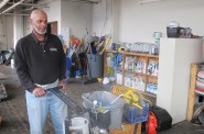 Ondra Stovall, CleanTec lead man since 2009, prepares to take cleaning equipment from the company’s storage room to a commercial client’s site. (Photo by Andrea Waxman)