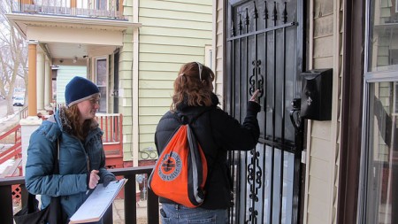 Nelle Kempfer, Wisconsin Humane Society outreach program manager, and Lisa Michel-Weiss, community outreach coordinator, go door to door offering the organization’s services to pet owners. (Photo by Andrea Waxman)