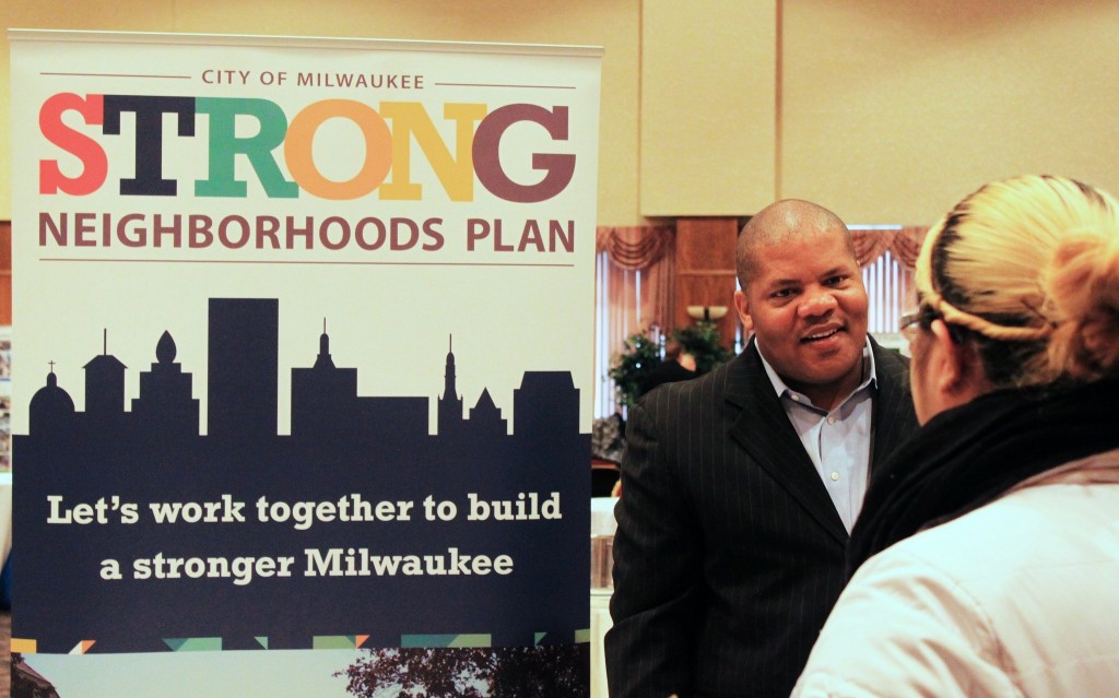 Attendees at the homeownership fair learn about the city’s Strong Neighborhoods Plan, which features forgivable loans and other options for making home buying affordable. (Photo by Matthew Wisla)