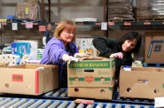 Volunteers from Northwestern Mutual package donations at Feeding America Eastern Wisconsin. (Photo by Molly Rippinger)